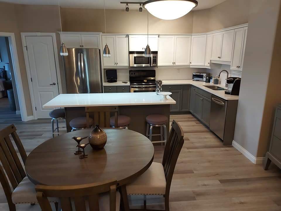 Kitchen cabinets repainted in white and grey